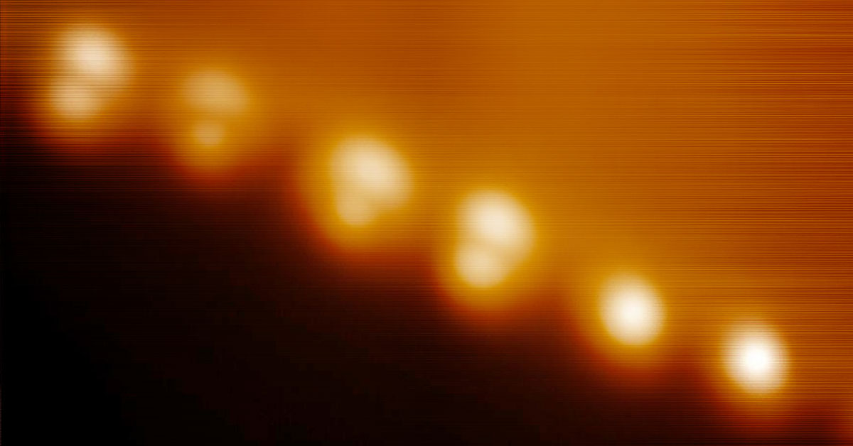Microscopic image of molecules attached to a metal surface.