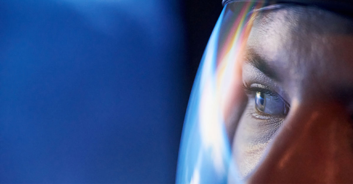 Close up of an astronaut's eyes inside helmet.
